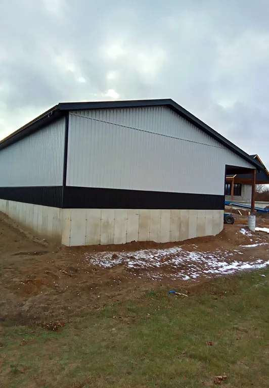 image of a white barn with metal roof